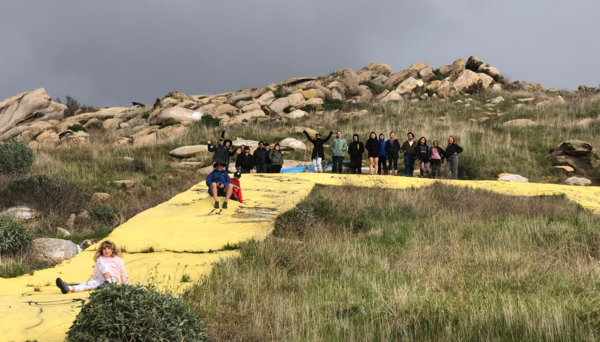 People sitting on a hill 